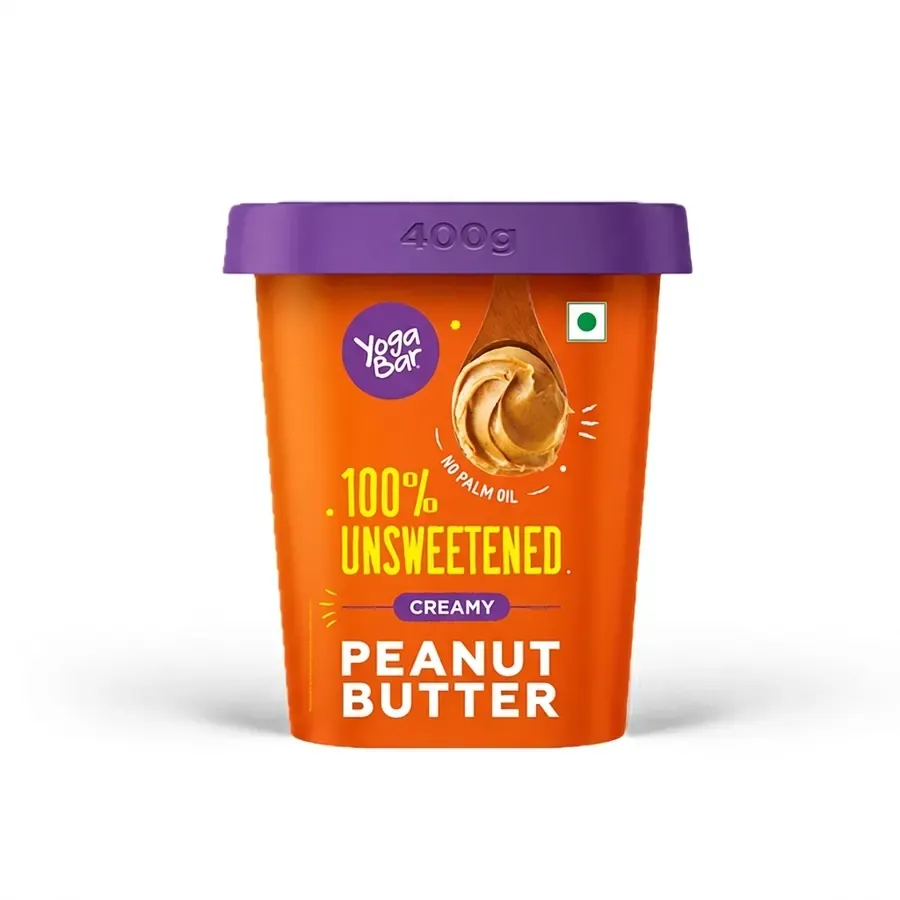 A tub of creamy peanut butter on white